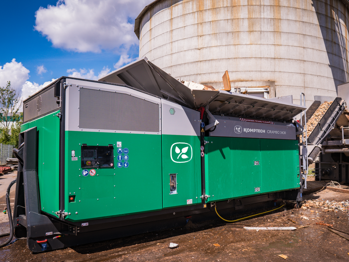 Komptech Crambo E-mobile electric shredder for wood and green waste, featuring a semi-mobile design with maintenance-free electric motor, offering energy-efficient and flexible shredding performance with throughput capacities up to 120 tons per hour.