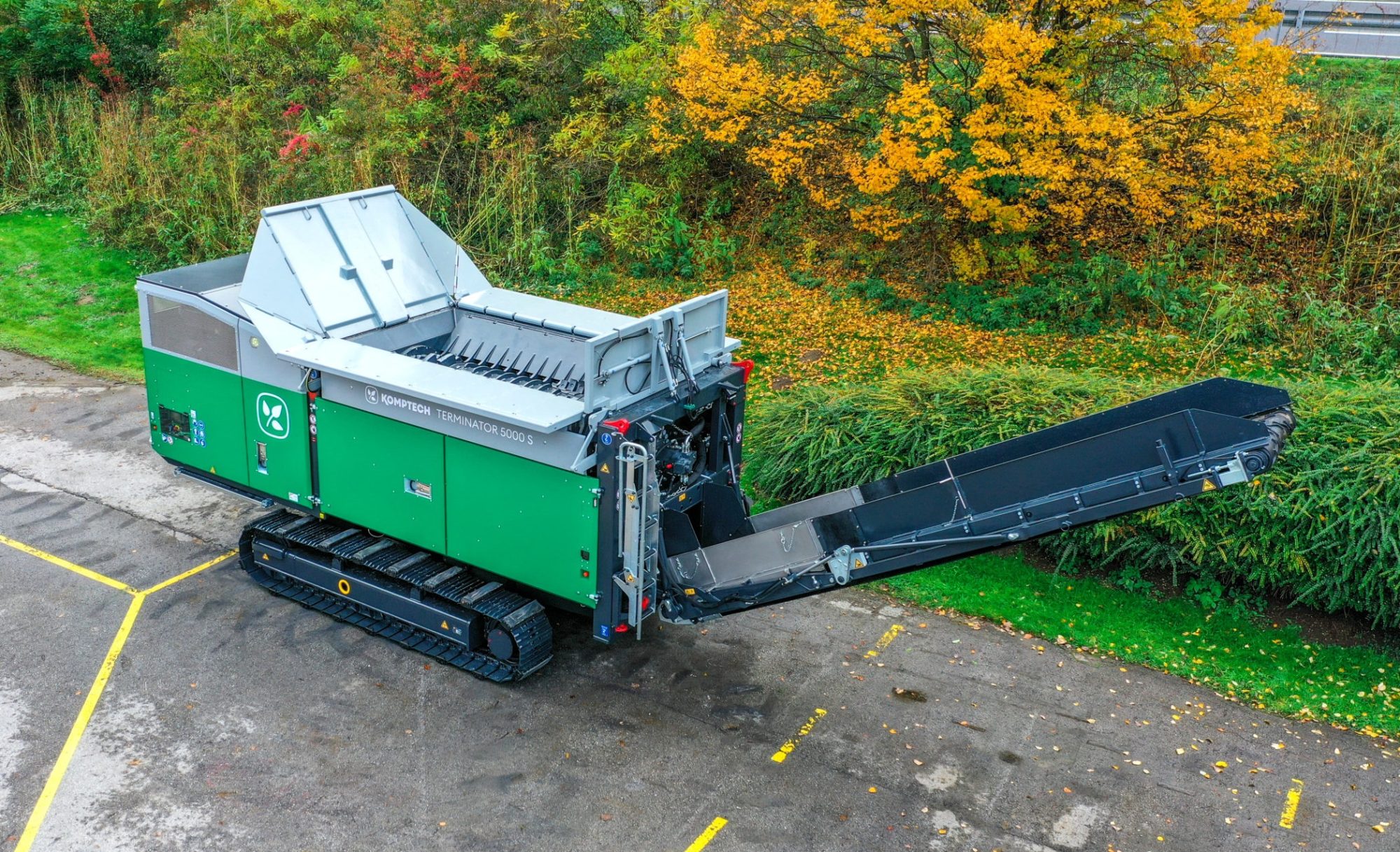 Komptech Terminator e-mobile electric-powered shredder processing municipal solid waste, showcasing its compact and mobile design for eco-friendly and efficient waste management.